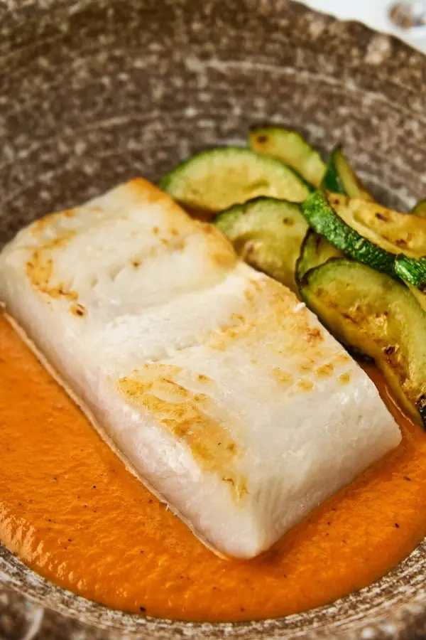 Seared fish with zucchini and pepper sauce