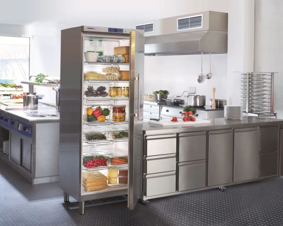 A restaurant kitchen fridge left open